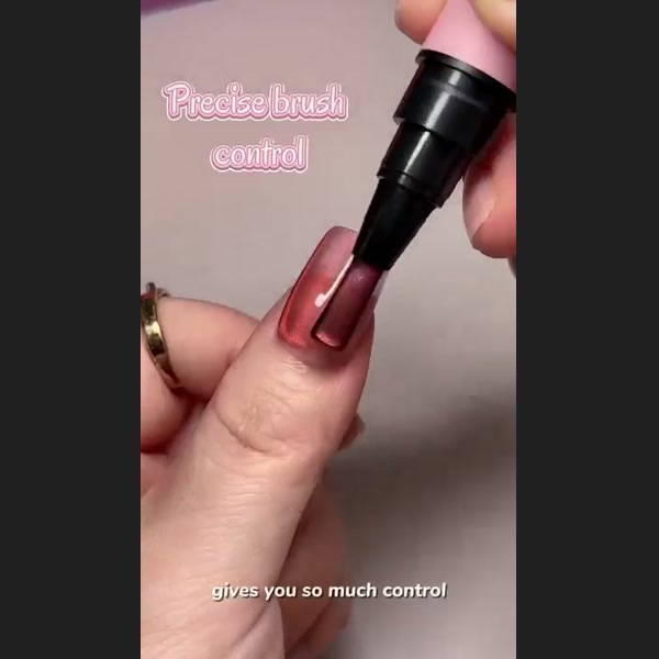 Cat-eye gel nail polish pen in use