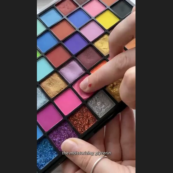 Adult Halloween face-paint palette in use