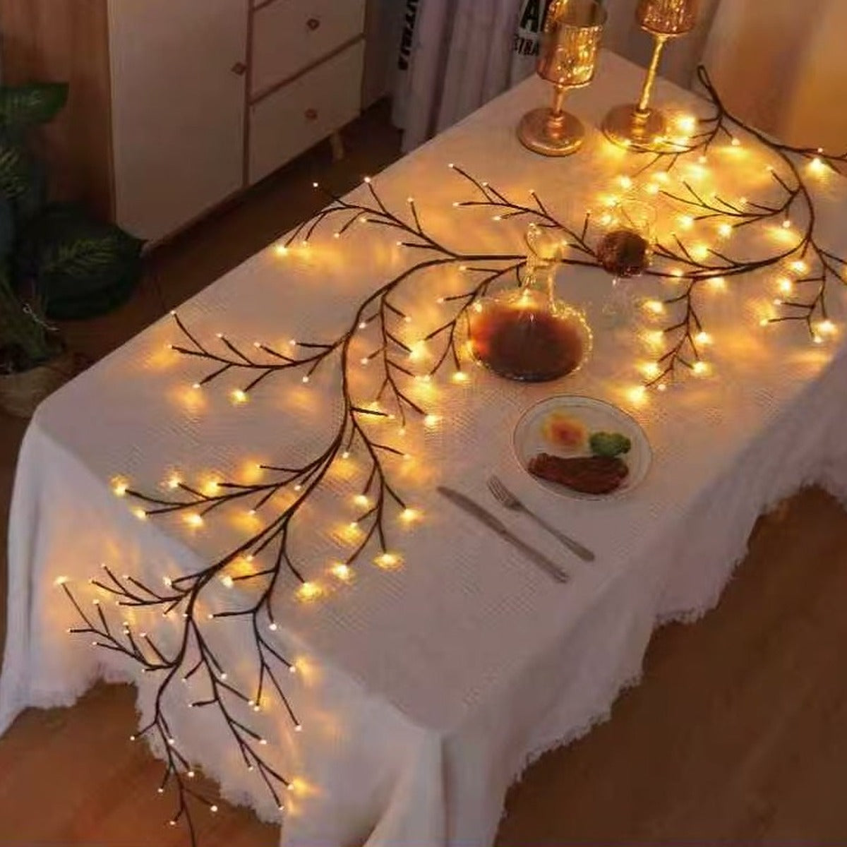 LED vine light draped across a dining table