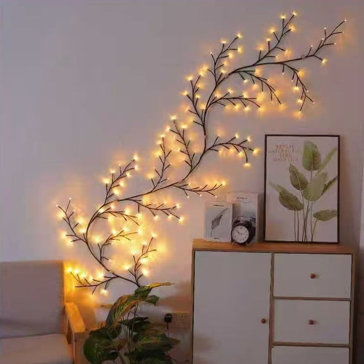 Bendable warm white LED vine light shaped across a living room wall